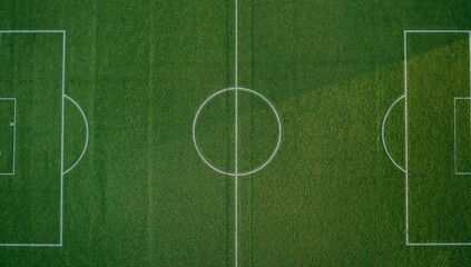 Naklejka premium Aerial view of artificial turf sports ground marked with white lines for multiple games