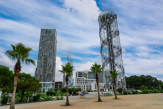 Batumi Alphabetic Tower rising above modern buildings in Batumi, Georgia - Powered by Adobe