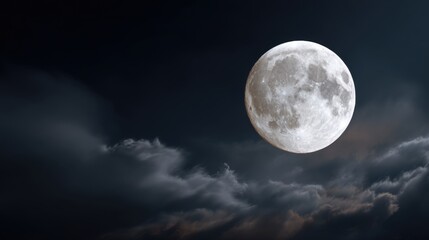 Majestic Full Moon Illuminates Night Sky Over Gentle Clouds