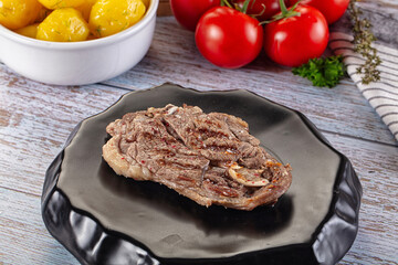 Grilled lamb steak with bone