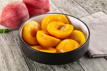 Sweet ripe yellow canned peaches
