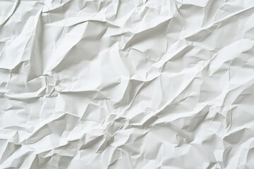 Fototapeta premium A close-up view of crumpled white paper, showcasing its textured surface and wrinkles, emphasizing its abstract and artistic qualities.
