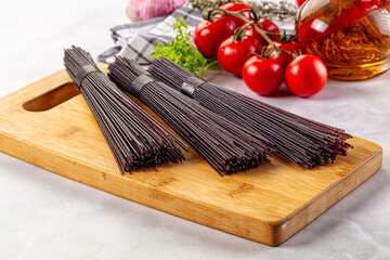 Raw black rice noodles lines