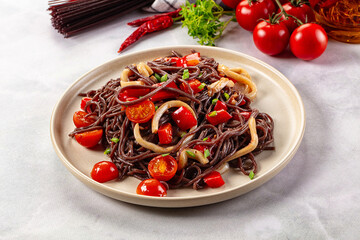Black rice pasta with squid and tomato