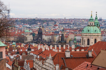 Fototapeta premium Prague, Czech Republic - April 5, 2025: View of the Charles Bridge and the Vltava River with ships passing by