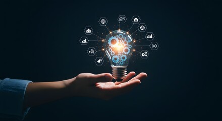 Innovative Idea Lightbulb with Gears and Technology Icons Held in Hand