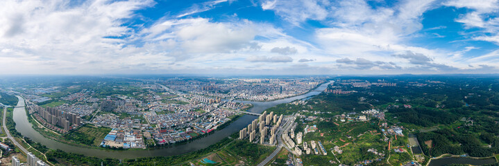 Cityscape panorama shows buildings and a river flowing through the urban landscape of Suizhou City,...