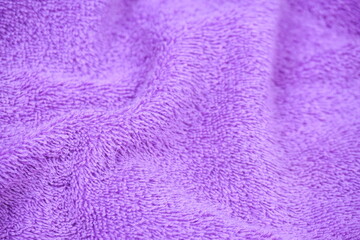 purple towel fabric texture background close up