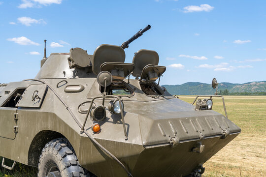 Old soviet BRDM-2 armored reconnaissance vehicle on open field