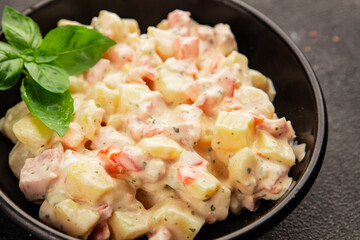 Potato salad ham, potato, tomato, carrot, mayonnaise tasty snack fresh delicious gourmet food background on the table rustic top view copy space