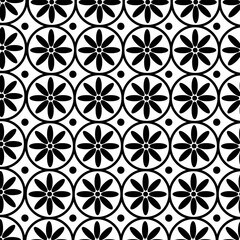 Seamless black and white pattern with  flowers enclosed within circles.