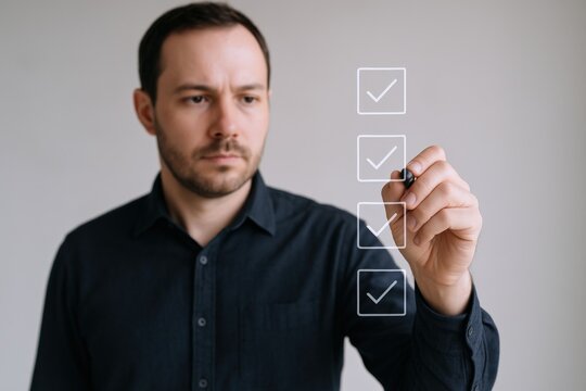 Man Completing Checklist on Transparent Screen, Demonstrating Efficiency and Task Management for Business Applications