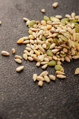 Seed mix sunflower seeds and pumpkin seeds natural product tasty snack fresh delicious gourmet food background on the table rustic top view copy space keto and paleo diet vegan and vegan food