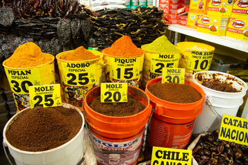 Stall selling varieties of fresh mole at the San Juan Market in Mexico City.