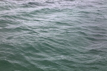 Sea water surface. Atlantic Ocean background. Water texture.