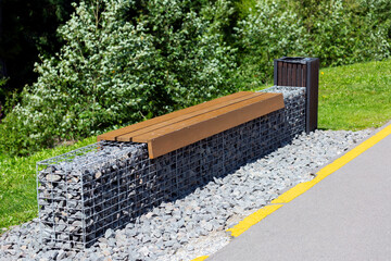 Stylish gabion bench with trash can.