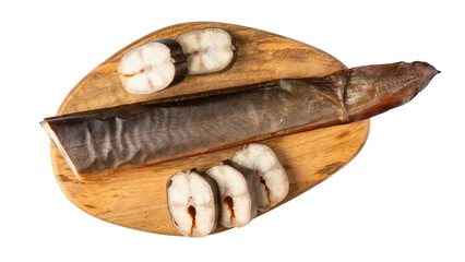 Smoked eel on wooden board isolated on white background. Fish delicacy ready to eat. Fish tail. Top view.