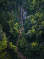 Majestic Waterfall in the Azores Surrounded by Lush Green Jungle – Aerial Drone View