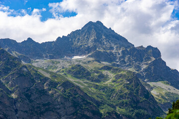 Majestic mountain peak dominating the Georgian landscape under a cloudy sky