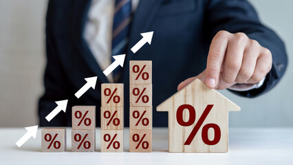 Business growth concept with rising percentage blocks and house symbol representing real estate investment