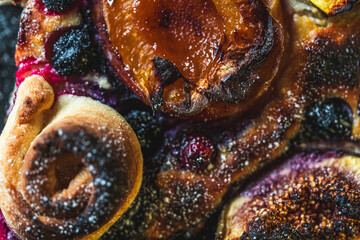 Background with the texture of sweet pie with apricot and figs. Close-up, top view. High quality photo