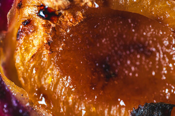 Background with the texture of baked apricot. Baked apricot close-up. High quality photo