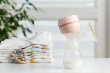 Electric breast pump with baby clothes and teether