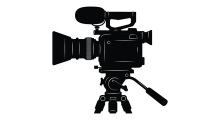 a professional video camera setup captured in silhouette