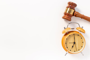 Alarm clock judges gavel, top view. Deadline and time management concept