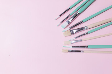 School supplies on a colorful background. Back to school background. Brushes, watercolors, pencils, ballpoint pens