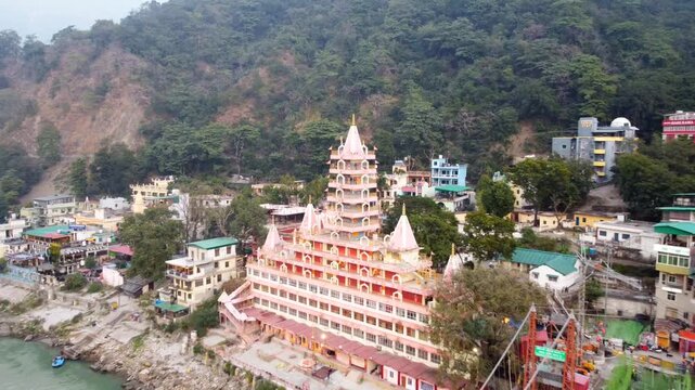 Rishikesh, Uttrakhand, India - October 10th 2024 - ​Trayambakeshwar Temple, also known as the Tera Manzil Temple. A vibrant architectural wonder on the banks of the Ganges River.