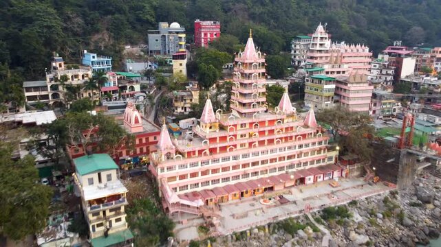 Rishikesh, Uttrakhand, India - October 10th 2024 - ​Trayambakeshwar Temple, also known as the Tera Manzil Temple. A vibrant architectural wonder on the banks of the Ganges River.