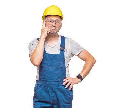 Pensive middle-aged construction worker, isolated on white background. Alone repairman frowning her face holding finger on temple being in confusion with crossed arms. Craftsman against white wall