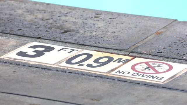 3 Feet Pool Sign In Cement On Ground.