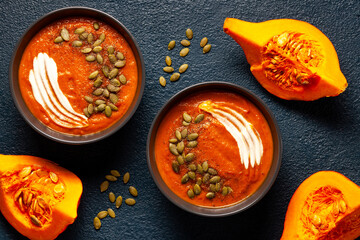 Pumpkin soup with seeds and spices close-up