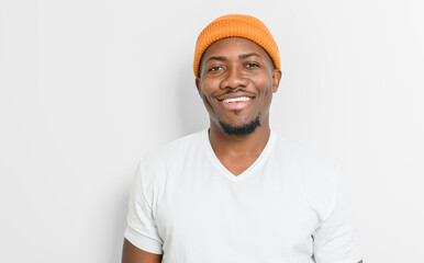 black man confident and casual on white background wearing hat