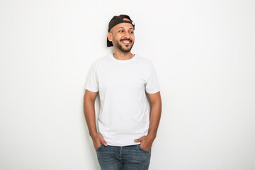 Fototapeta premium young islamic arab man against white studio wall