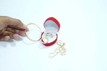 Beautiful gold jewelry. Gold jewelry on a white background.