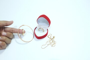 Beautiful gold jewelry. Gold jewelry on a white background.