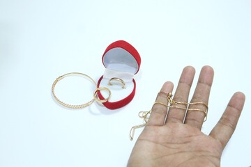 Beautiful gold jewelry. Gold jewelry on a white background.