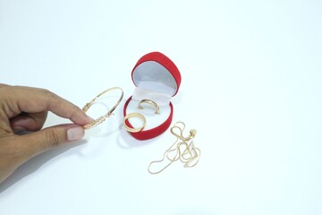 Beautiful gold jewelry. Gold jewelry on a white background.