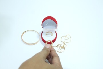 Beautiful gold jewelry. Gold jewelry on a white background.