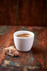Cup of coffee on rustic wooden background. Soft focus. Copy space	