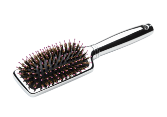 Closeup View of a Paddle Hair Brush with Black Bristles and Silver Handle isolated on transparent background