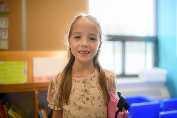 Adorable five year old girl ready for first day of school
