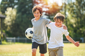 kids play football or soccer on a outdoor field © Louis-Paul Photo