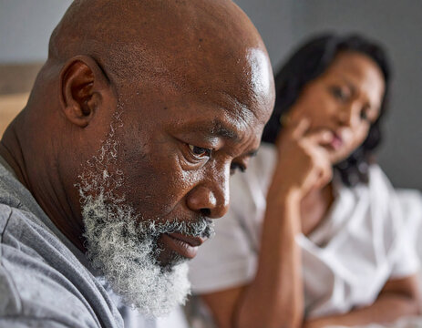 African American black man face looking sad with wife after arguing about erectile dysfunction during stressed argument with wife