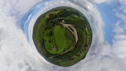 A tiny planet aerial view of the Lambley Viaduct in Northumberland, UK