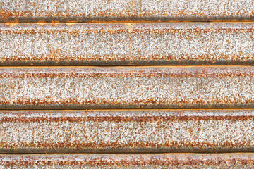 Rusty iron gate surface. Corroded industrial background. Weathered steel detail. Old damaged texture. Metallic decay with corrosion. Vintage rough material. Industrial grunge backdrop. Timeworn iron p