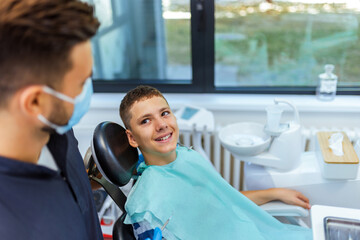 Dentist Examining Boy’s Teeth in Modern Dental Clinic